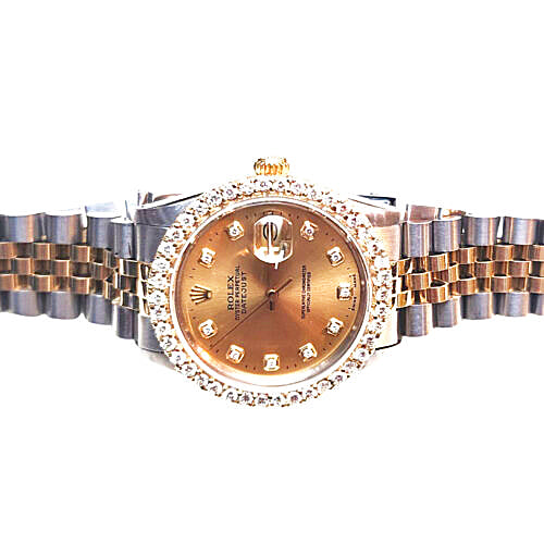 Rolex Datejust watch with a gold dial, diamond hour markers, a diamond bezel, and a two-tone gold and stainless steel Oyster bracelet, shown against a white background.