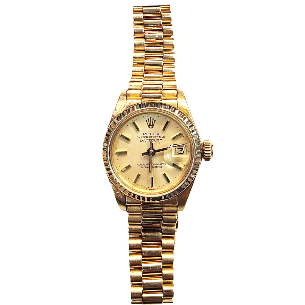 Rolex Datejust watch in yellow gold with a gold dial and a matching gold link bracelet, shown against a plain white background.