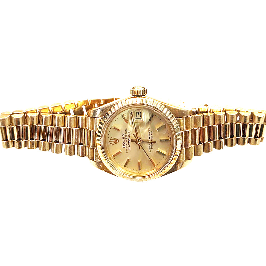 A gold-tone Rolex Lady Datejust watch with a gold dial and integrated bracelet, shown against a plain white background.
