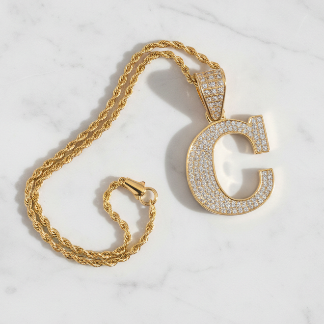 C pendant on white marble