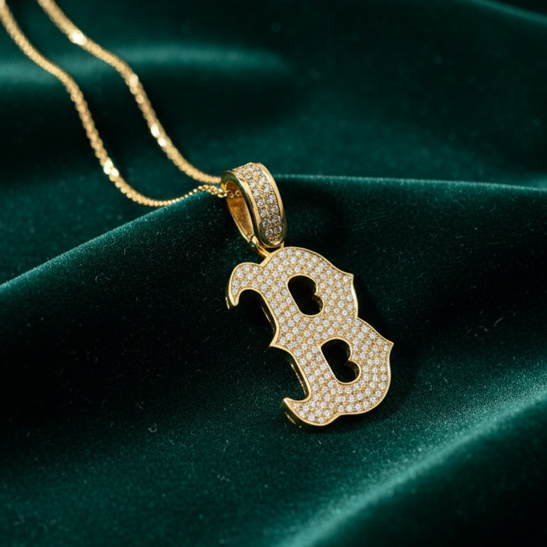 Diamond B pendant on green velvet