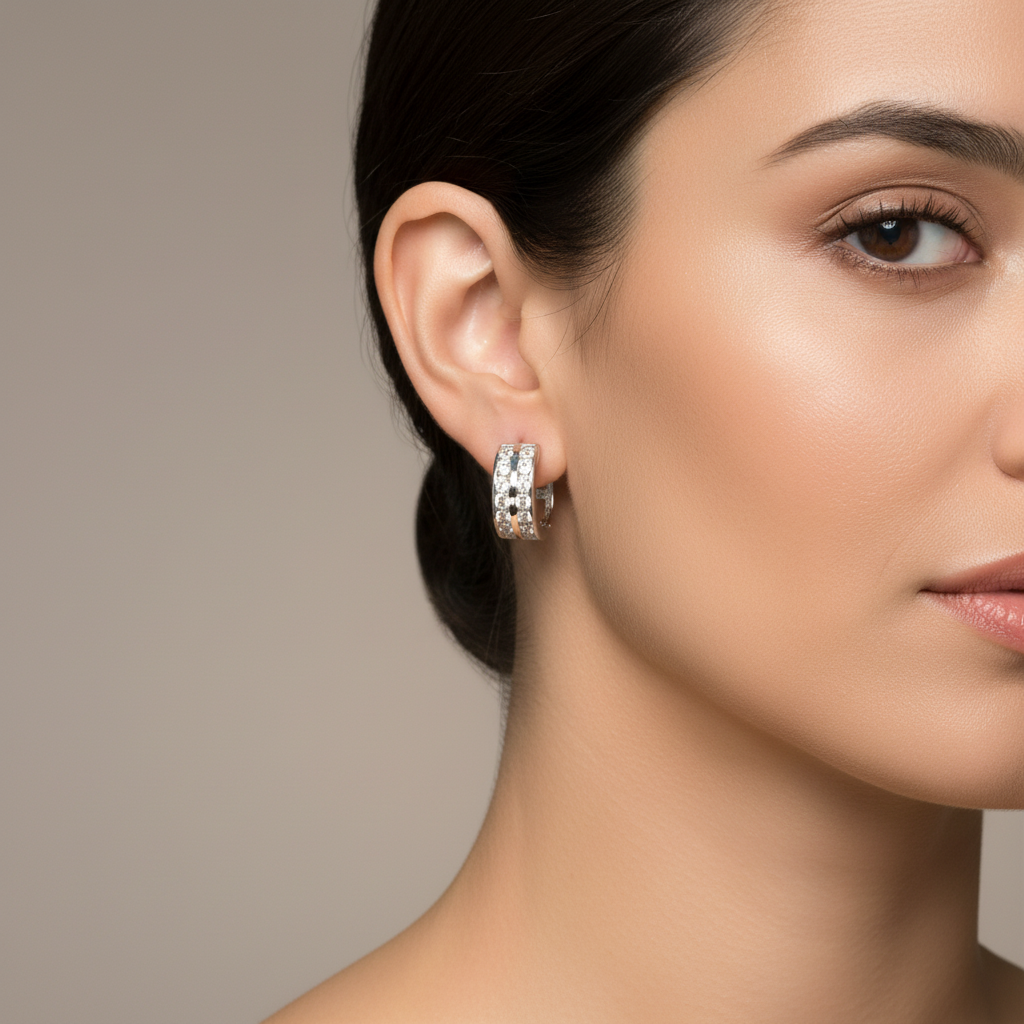 Diamond hoop earrings worn on a woman's ears