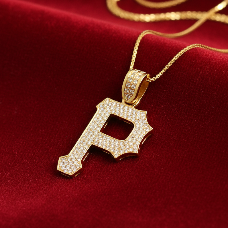 Diamond P pendant on red velvet