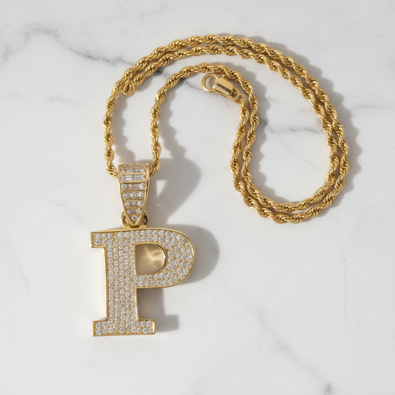 P pendant on white marble