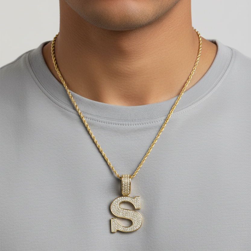 S pendant worn on a man's neck
