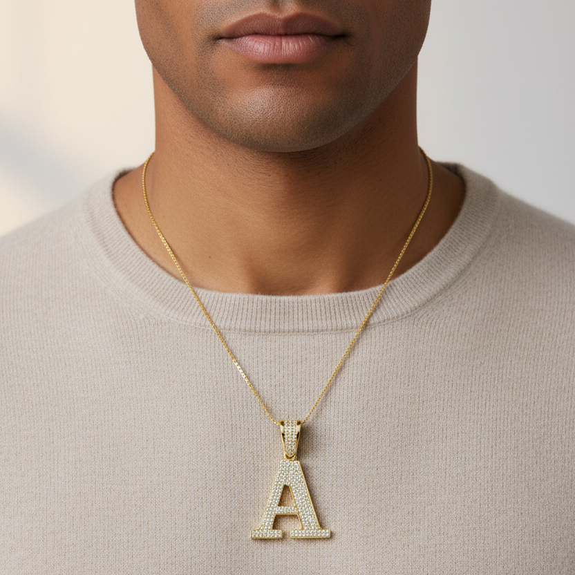 Zoomed-out men’s neck shot with A pendant